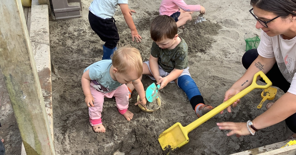 sandpit with yellow spade