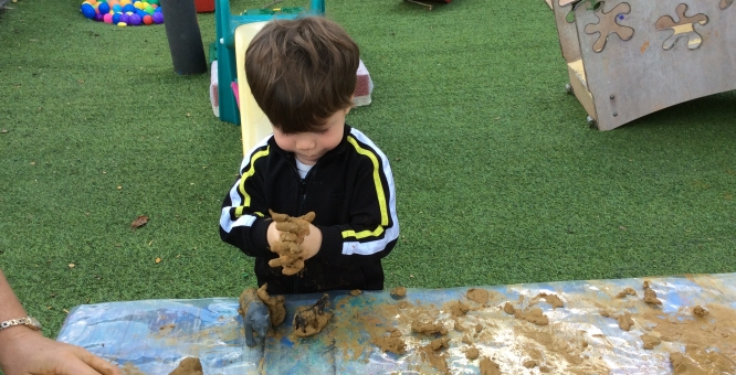 Our babies exploring clay