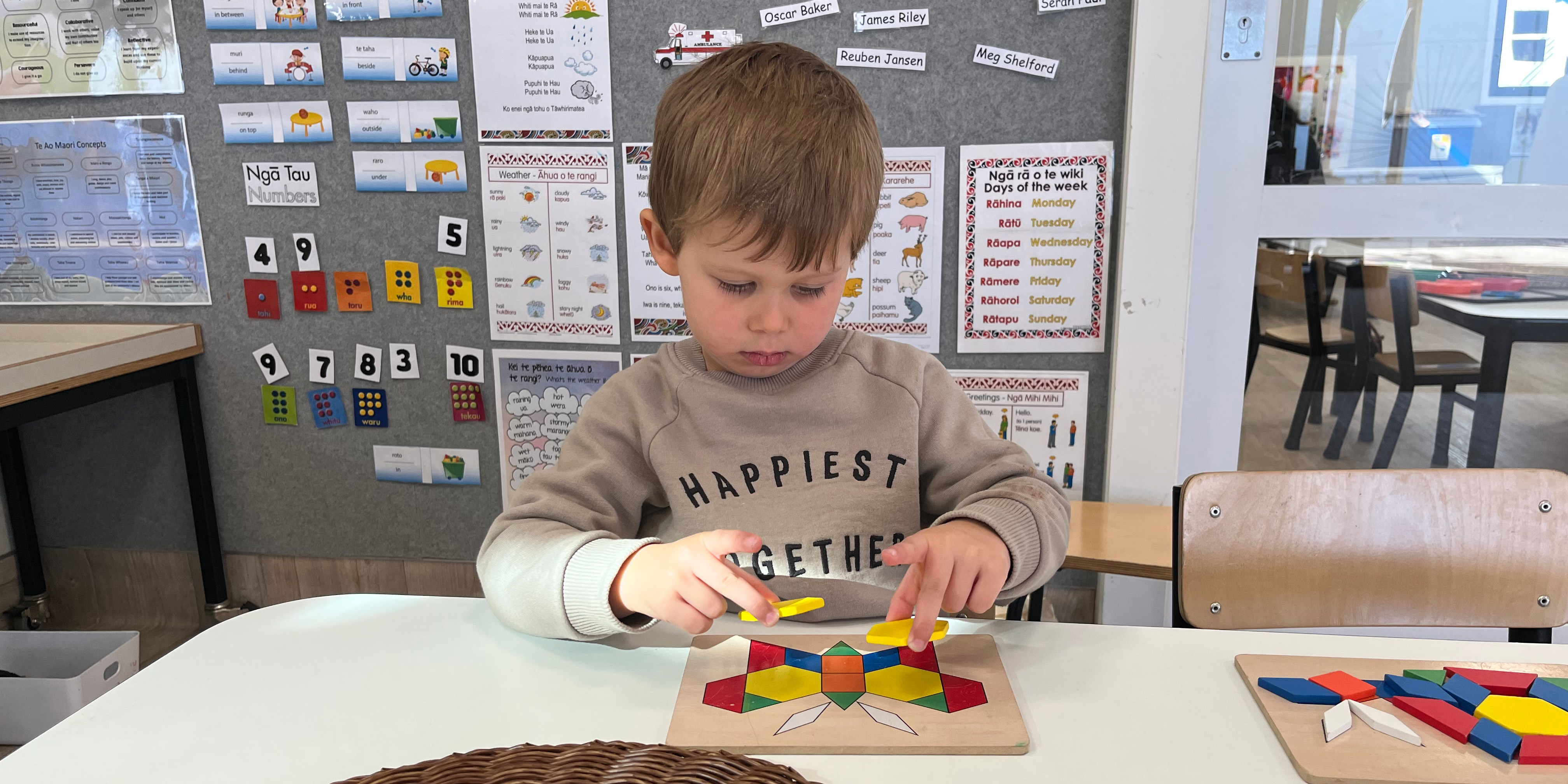 boy learning with colourful wheel 