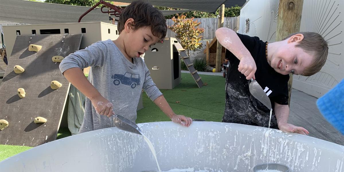 Two Boys playing with gloop