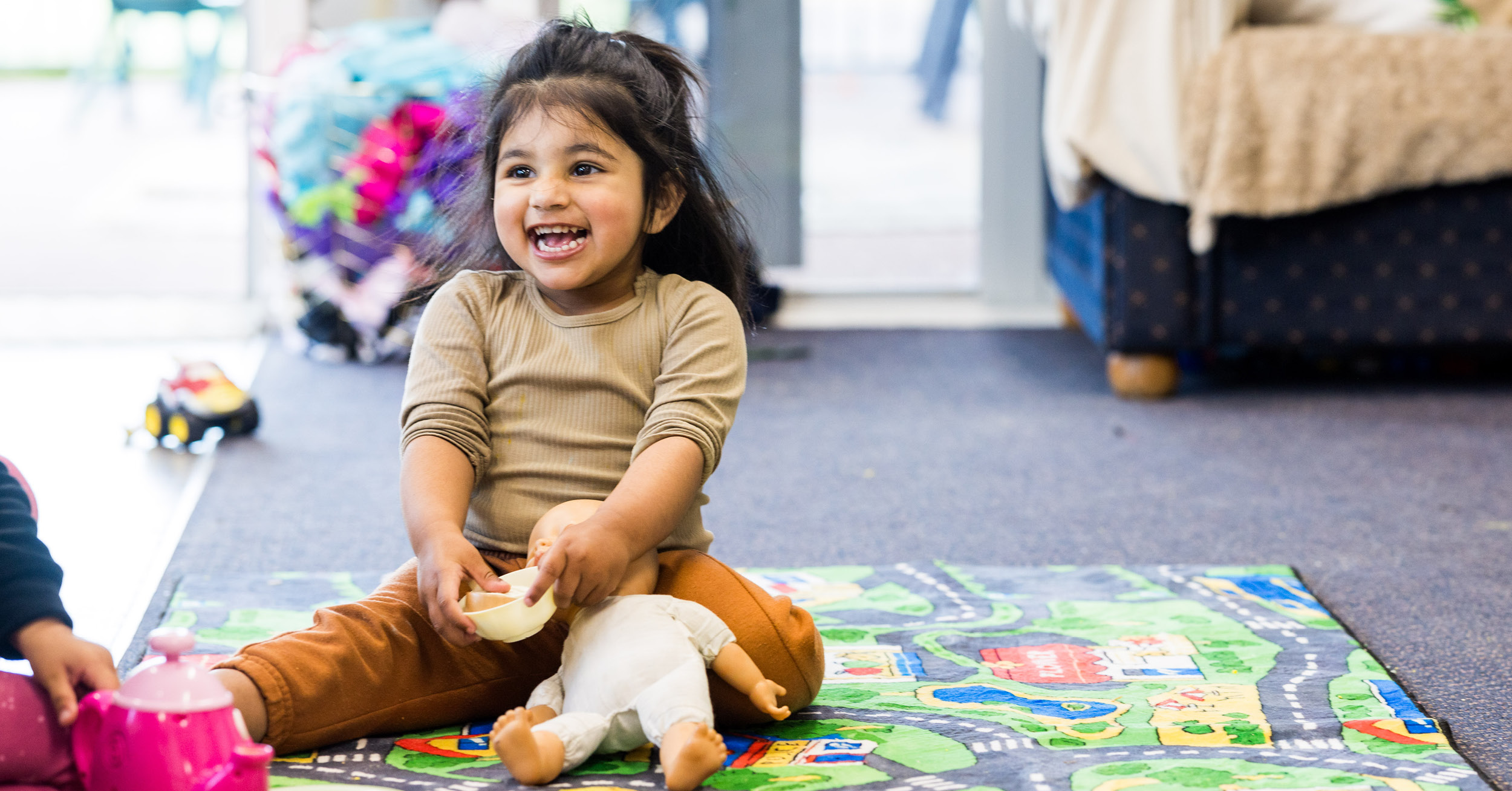 1727728508Girl laughing on floor Sept2024.jpg