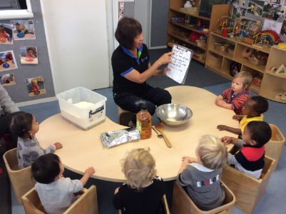 1556501908Making playdough together in the Under Two's and reading the recipe.JPG