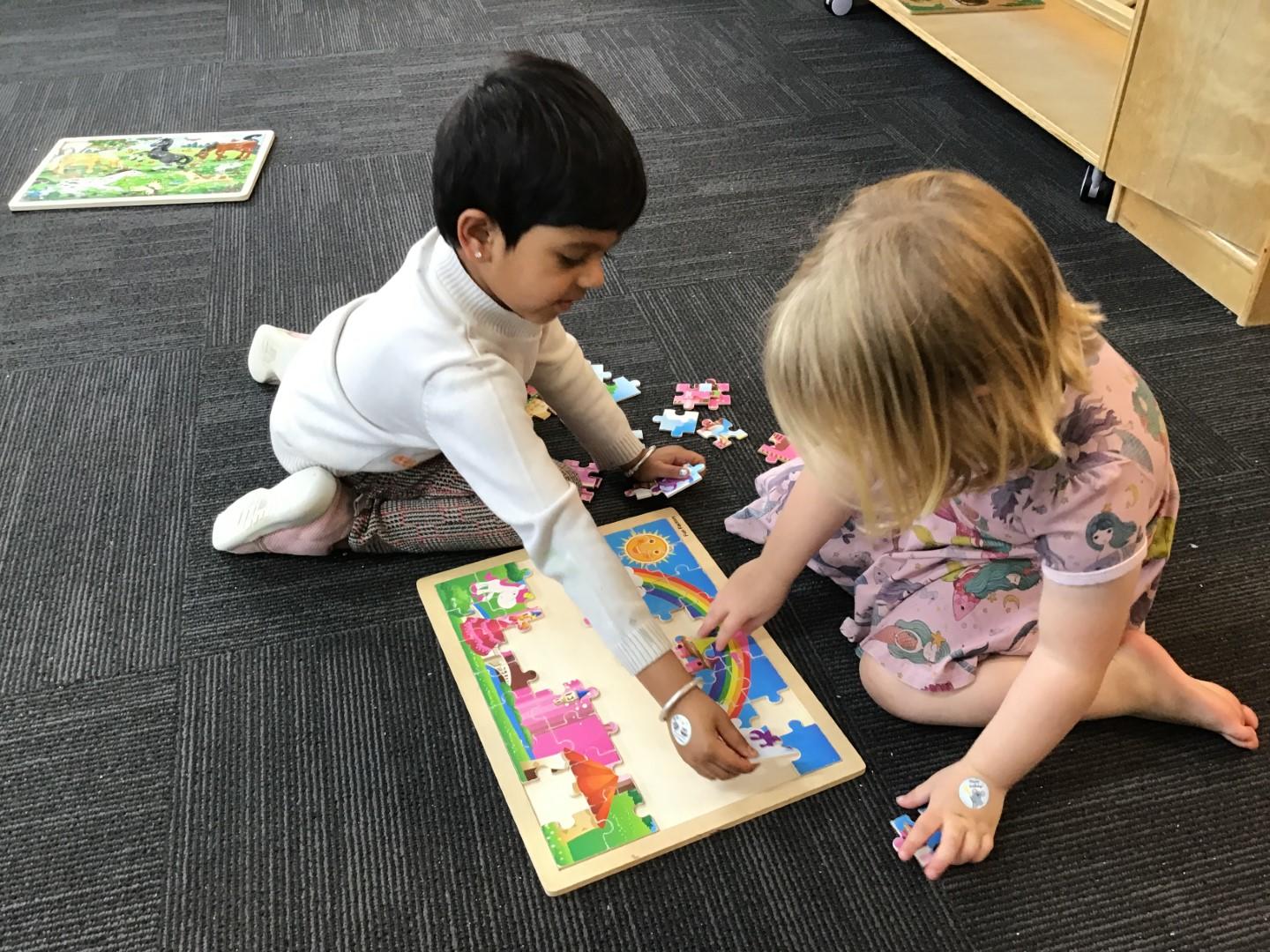 1641770263Working together on a puzzle.JPG